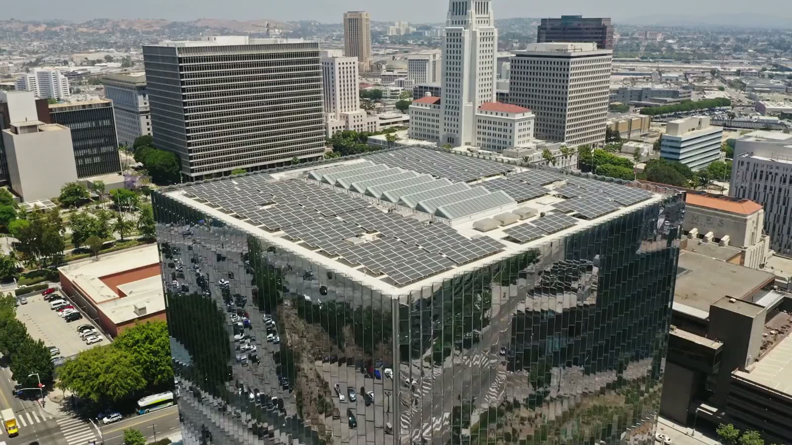 Aerial view of a large commercial rooftop with solar panels