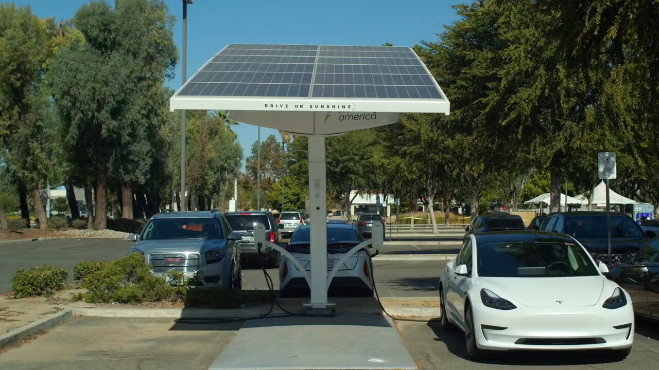Electric cars charging under a solar canopy
